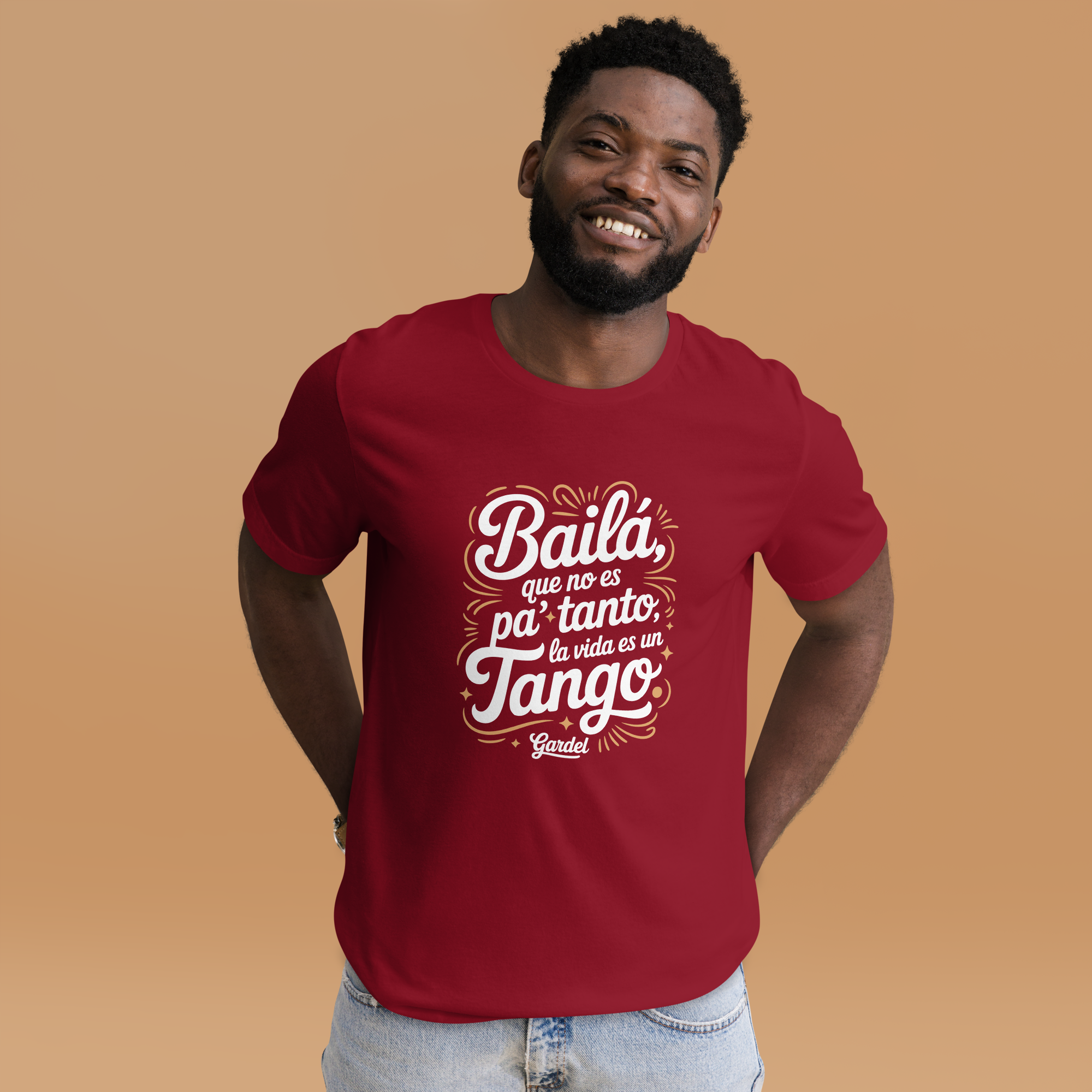 Man wearing a red t-shirt with Spanish text on a brown background