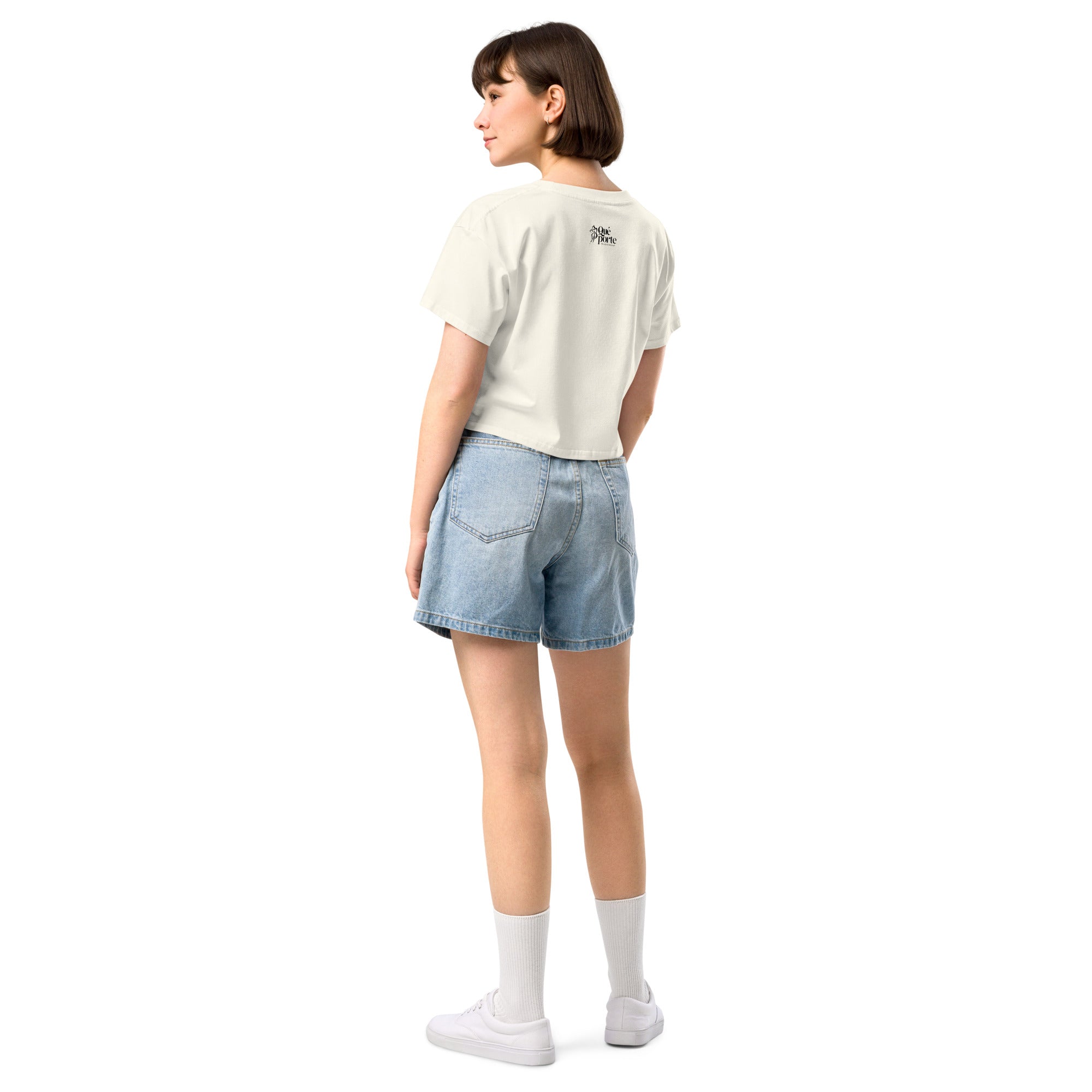 Person wearing a white t-shirt and denim shorts on a white background
