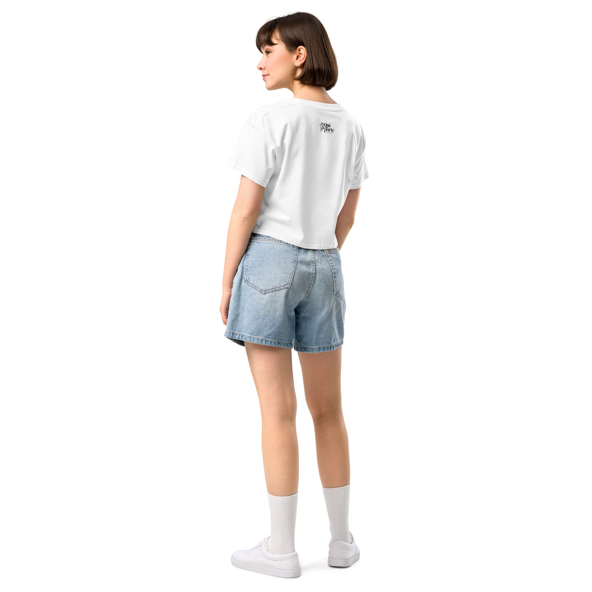 Person wearing a white t-shirt and denim shorts on a white background