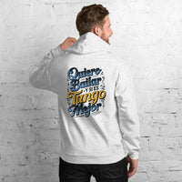 Person wearing a hoodie with text on the back against a white brick wall