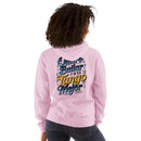 Person wearing a pink sweatshirt with colorful text on the back, standing against a white background