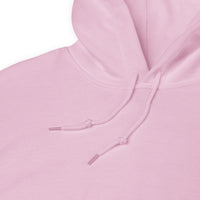 Close-up of a pink hoodie with a focus on the drawstring.