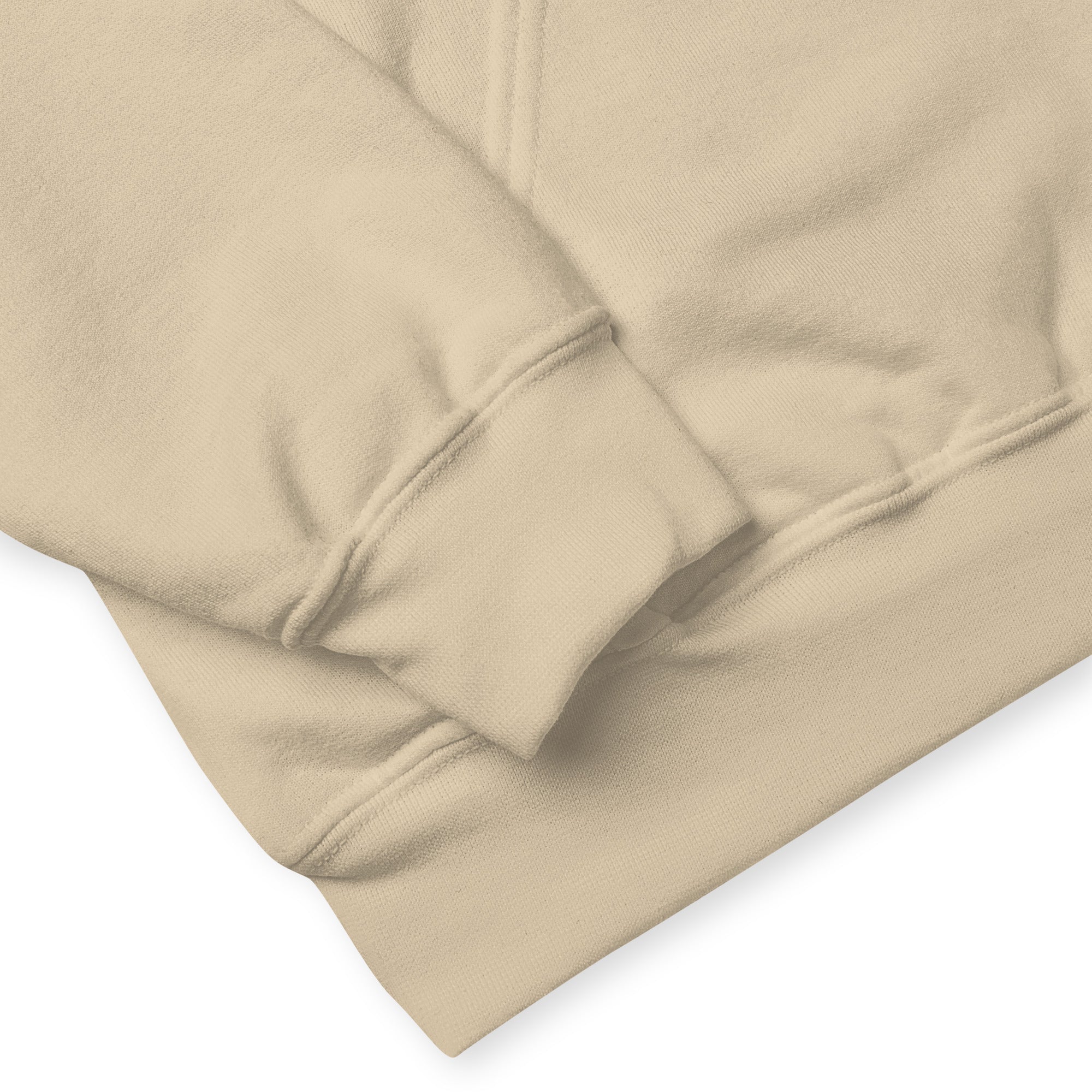 Close-up of beige fabric with a white background