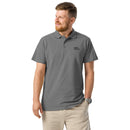 Man wearing a gray polo shirt with a logo on a white background