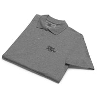 Folded gray polo shirt with a logo on a white background