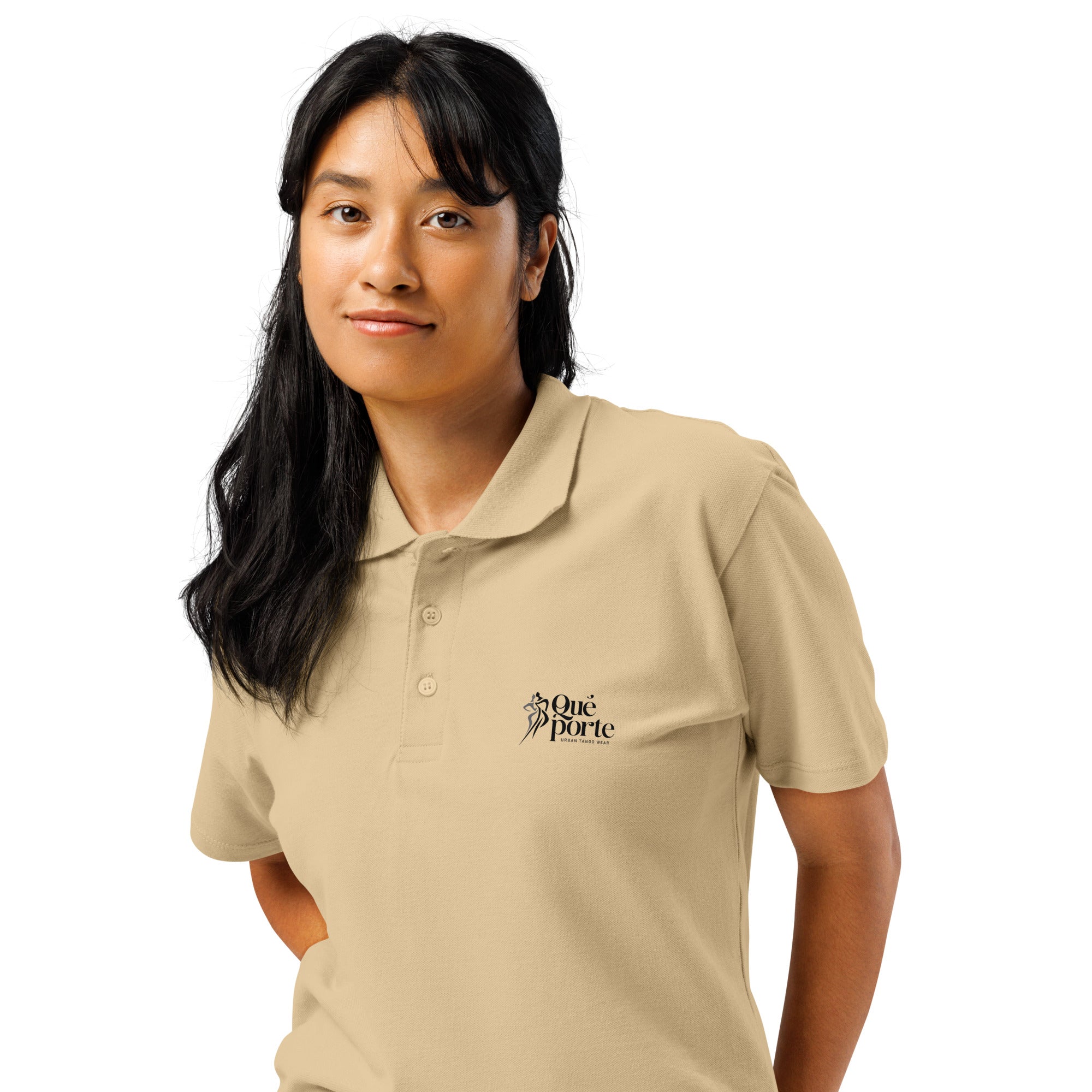 Woman wearing a beige polo shirt with a logo on a white background
