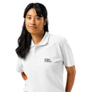 Woman wearing a white polo shirt with a logo on a white background