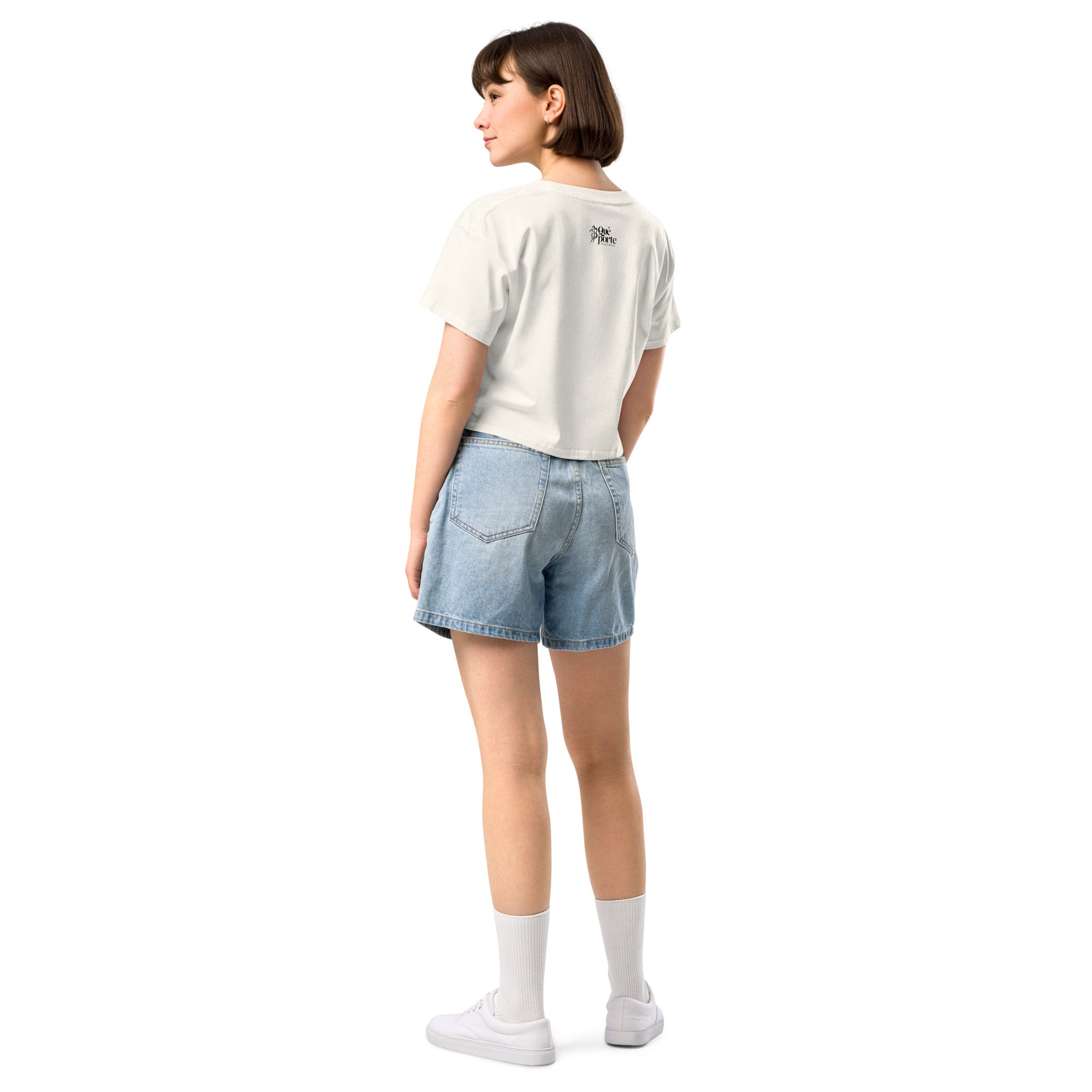 Person wearing a white t-shirt and denim shorts on a white background