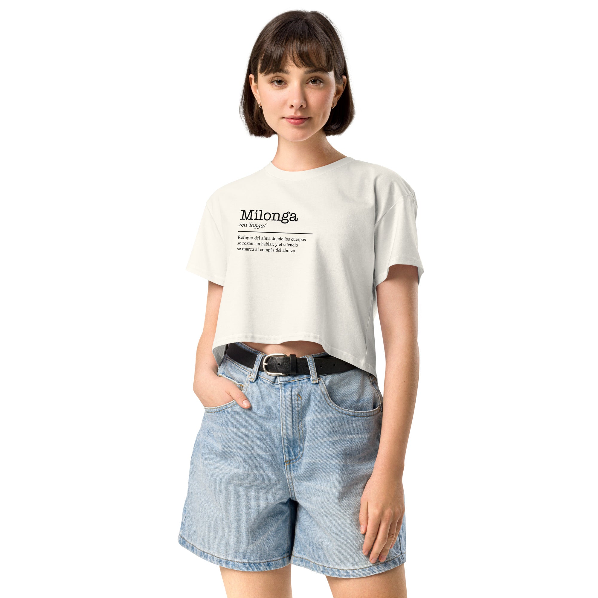 Woman wearing a white t-shirt with text and denim shorts on a white background