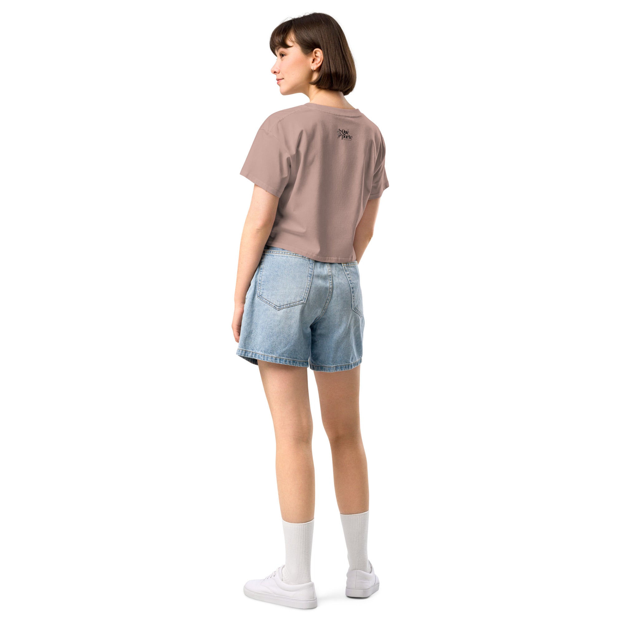 Person wearing a brown t-shirt and denim shorts on a white background