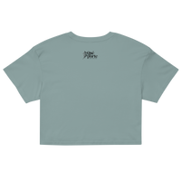 Light blue crop top with a brand logo on the back against a white background