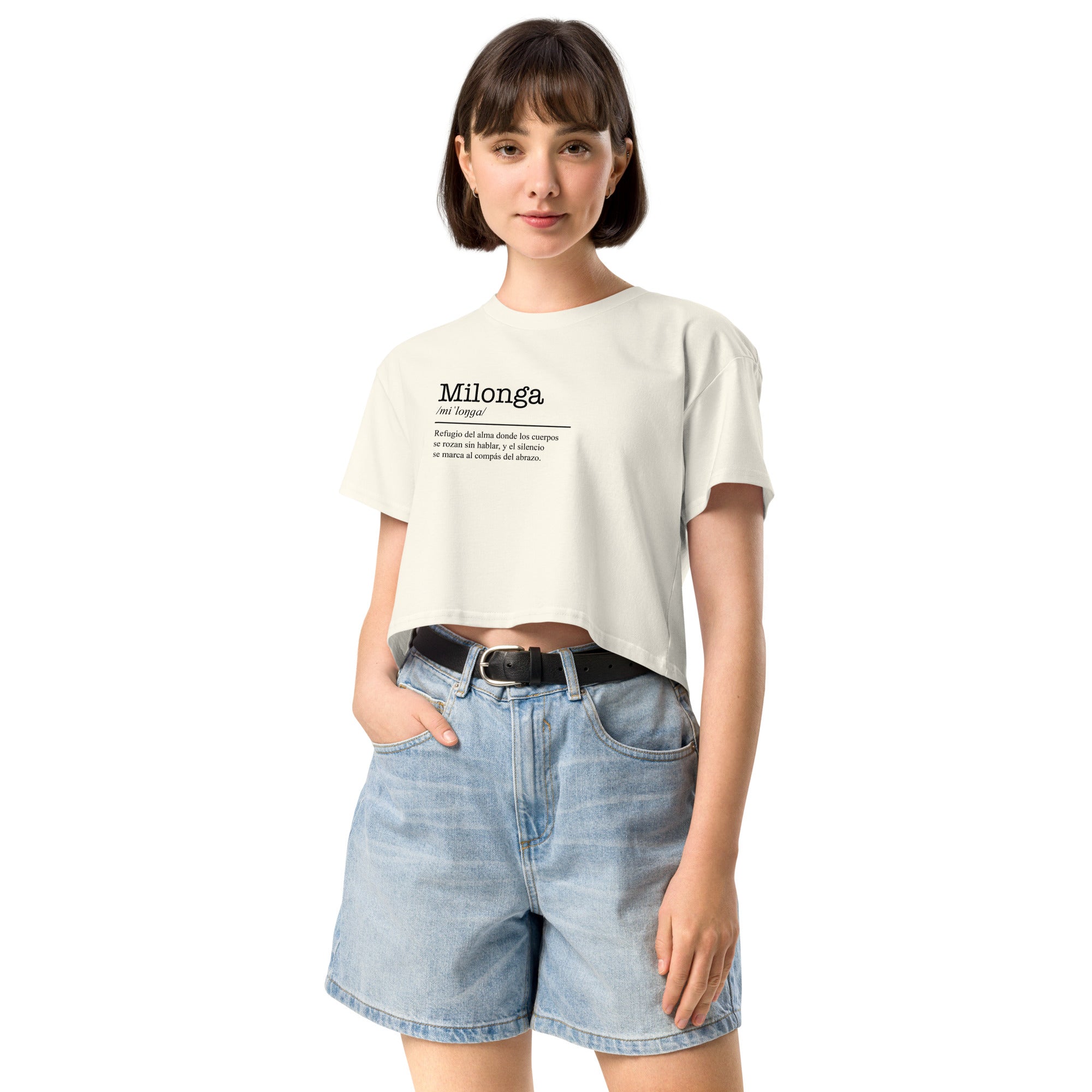 Woman wearing a white t-shirt with text and denim shorts on a white background