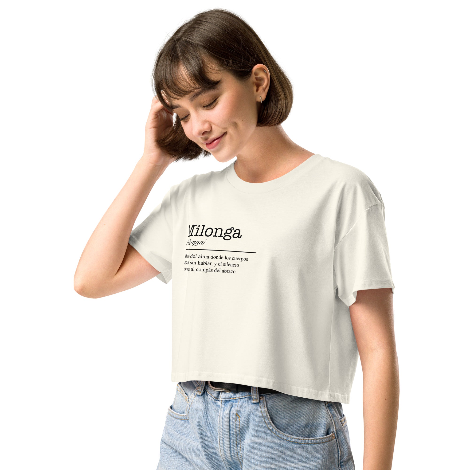 Woman wearing a white t-shirt with text, standing against a white background