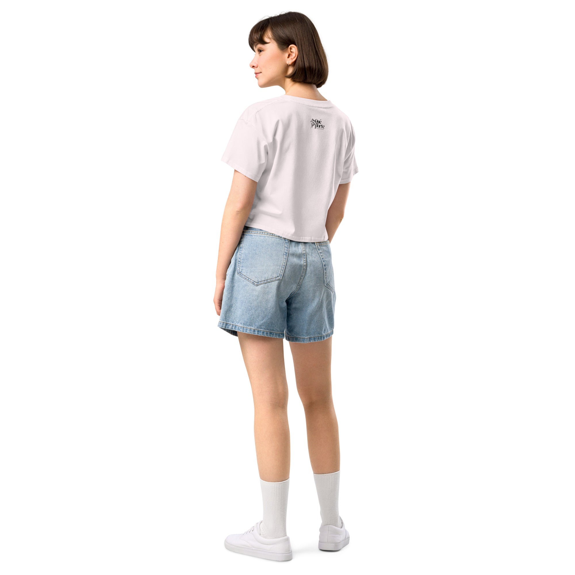 Person wearing a white t-shirt and denim shorts on a white background