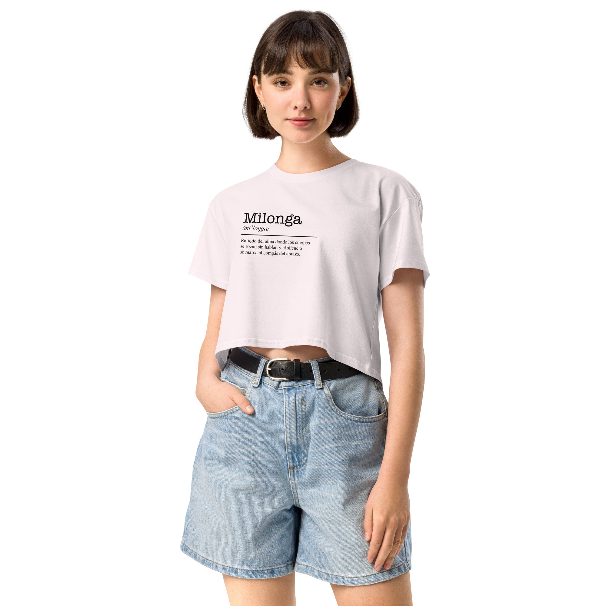 Person wearing a white t-shirt with text and denim shorts on a white background