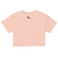 Pink crop top with a brand logo on the back against a white background