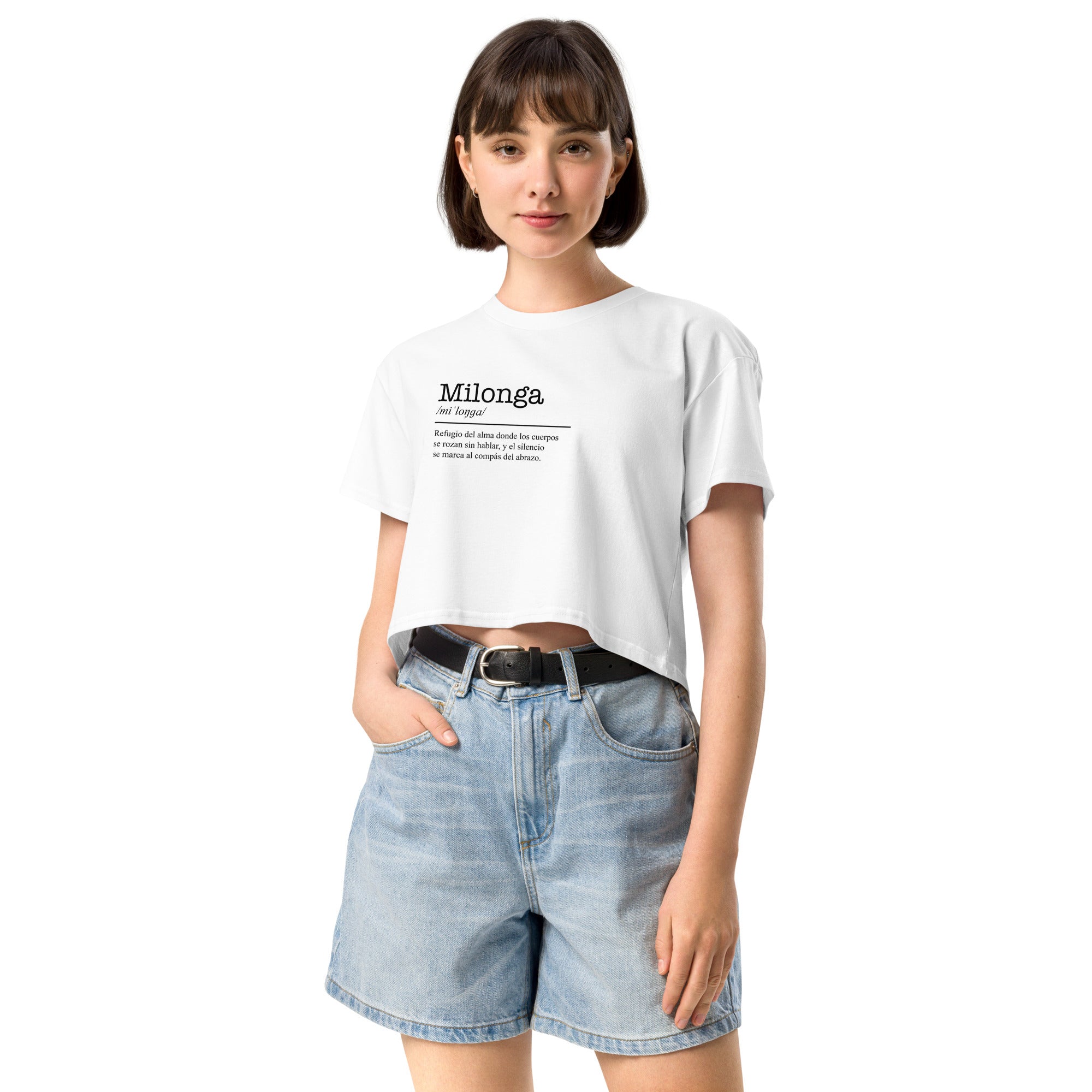 Person wearing a white t-shirt with text and denim shorts on a white background