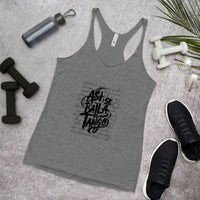 Gray tank top with black text on a gray surface with fitness items