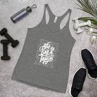 Gray tank top with white text on a gray surface with fitness items