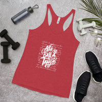 Red tank top with white text on a gray surface with fitness items.