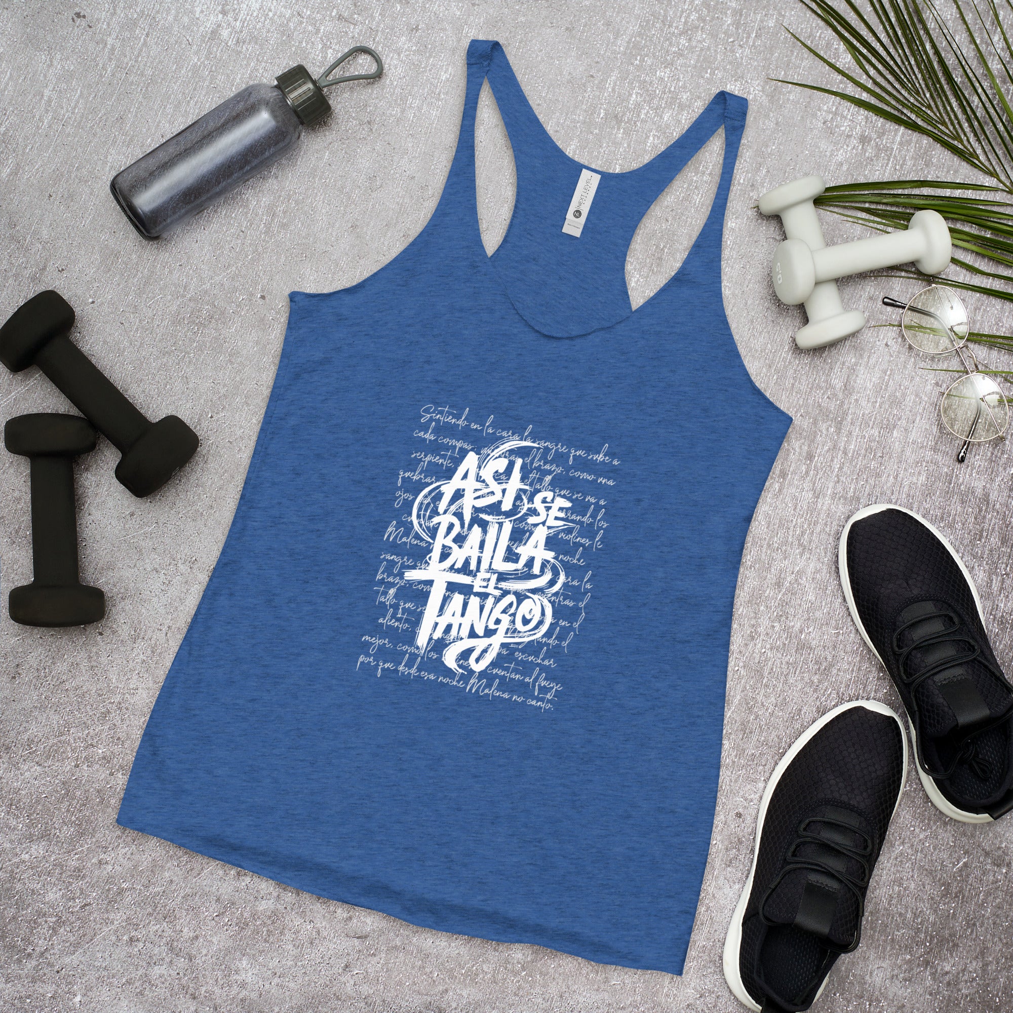 Blue tank top with white text on a gray surface with fitness items around