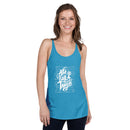 Woman wearing a blue tank top with white text on a white background